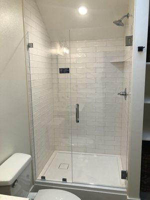 Frameless Shower Enclosure Using 3/8" Starphire Glass with Chrome Square Hardware and 8" Standard Series Handle