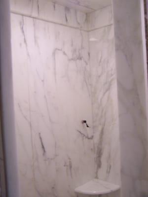 Calcatta Gold Shower walls by Stone Solutions of Atlanta