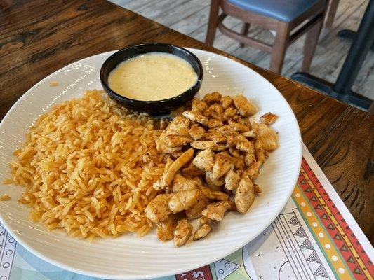 Kids Grilled chicken with rice and side of queso dip.