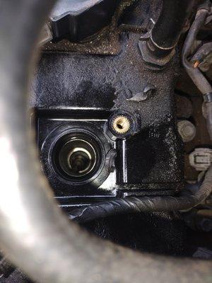 A broken spark plug needs to be extracted