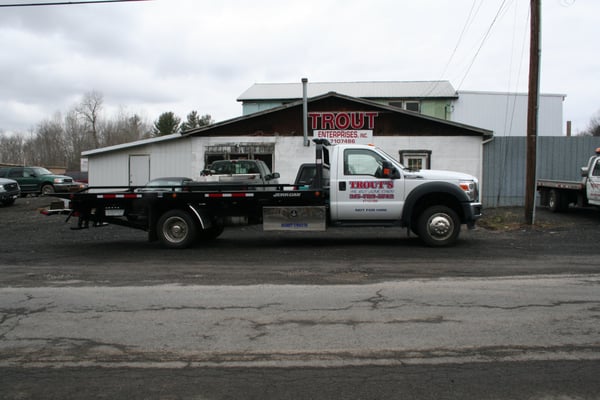 Our 2011 Ford Rollback for your junk car removal pleasure infront of our old building that burnt down in 2011.