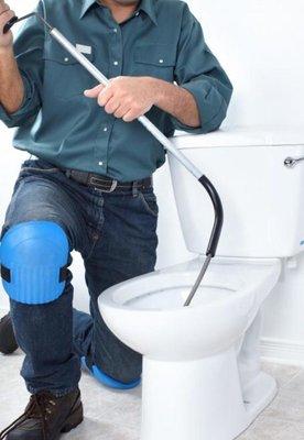 Unclogging a toilet, drain cleaning.