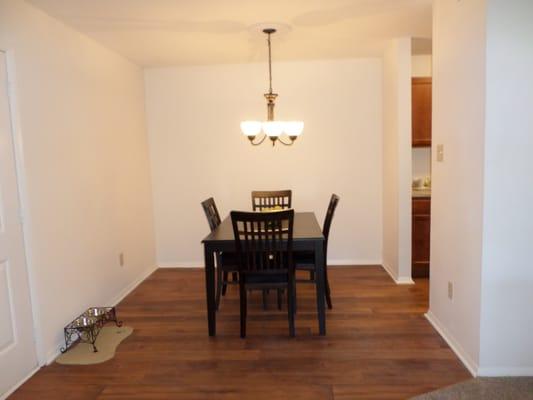 Spacious dinning room with updated flooring.