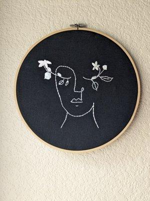 Hand embroidered line art from Woven Goods Studio.