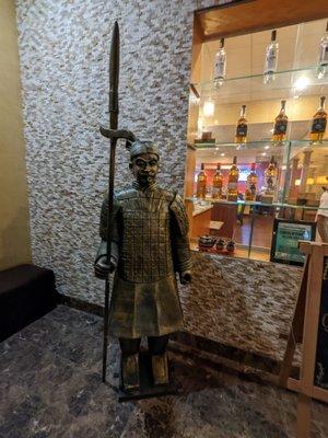 One of the terracotta warrior statues standing guard in the foyer