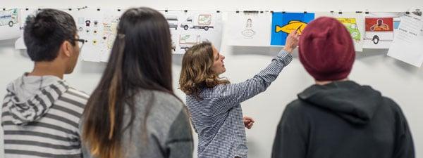 SVC instructor, art director, Lori Peck, takes students through a critique of their work -- the backbone of SVC's evening portfolio classes.