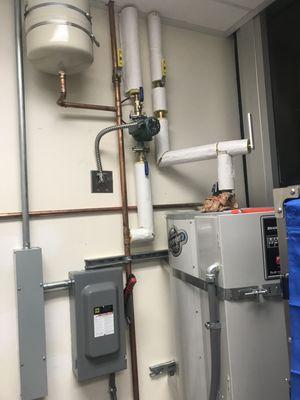 water heater, expansion tank and recirculation pump installed