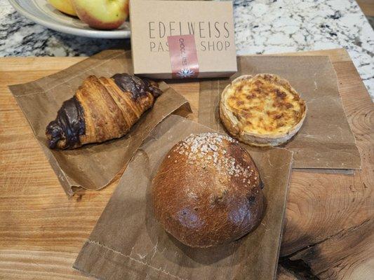 A small box of truffles, a gruyere and caramelized onion tart, a blueberry and chocolate brioche, ans a chocolate croissant!