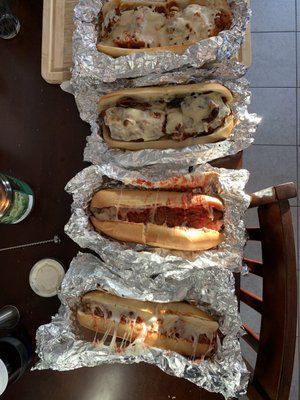 From top to bottom: Buffalo chicken sub, chicken cutlet sub, chicken parm sub, meatball parm sub.