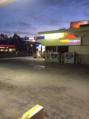 Gas pumps with the a.m. p.m. market inside