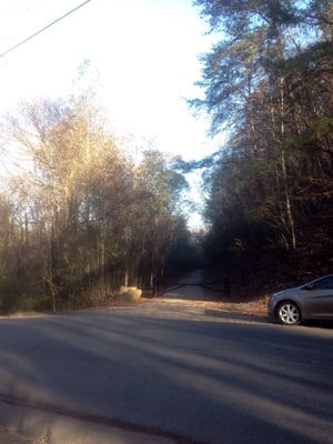 Across Shady Grove Road looking at the entrance of Rail to Trail path.