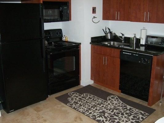 Kitchen at The Fountain - Full size dish washer, stove, refrigerator, microwave, toaster oven, washer and dryer