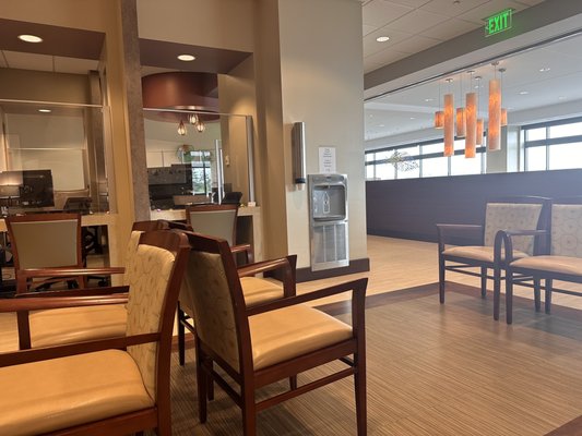 Ample waiting room seating and water bottle filling station.