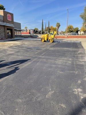 Roller rolling asphalt pavement