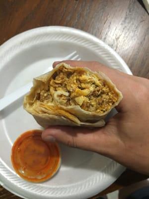 Chorizo breakfast burrito, has egg, onion, and cheese as well, great with the red hot sauce.