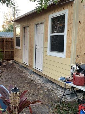 Storage building in process of siding install