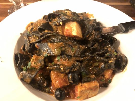 Squid ink pappardelle with Swordfish and Tuna.  Fish is a bit dry, but pasta and sauce is lovely