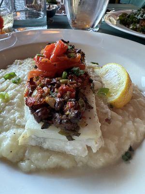 Haddock Tapenade- baked haddock with olives, capers, and sun-dried tomato tapenade. Served over lemon risotto.