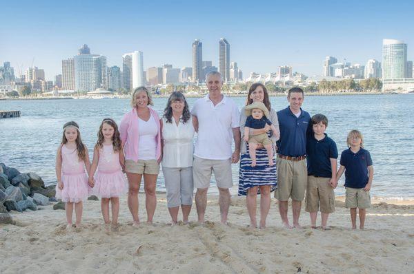 Beautiful San Diego Family Portrait with city sky long as the background by Celi Photography