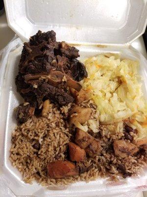 Oxtails with rice and peas and cabbage