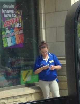 Pregnant female smoking outside her job