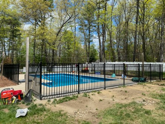 54" black aluminum fence around a  pool