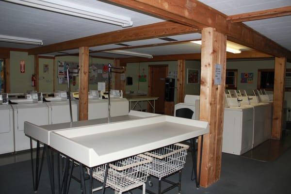 Clean, spacious facility with many folding tables.