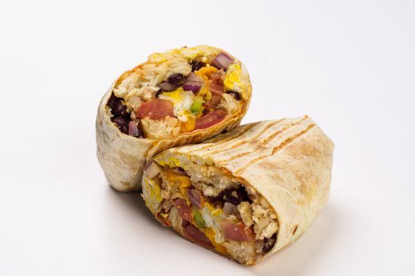 Breakfast burrito with egg, cheese, black beans, tomato's, red onion, avocado, hash brown, cheddar cheese, and chipotle mayo