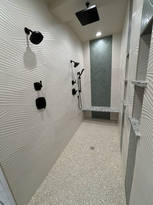 Spacious zero-entry walk-in shower: seamless access, expansive design for ultimate comfort and modern elegance.