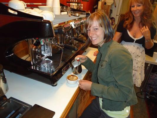 Student learning to pour her first latte art!