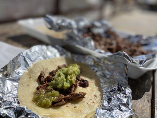 Skirt steak, guac, salsa verde in delicious tortillas