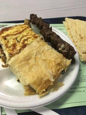 Moussaka, beef kebab, pita, and spanakopita