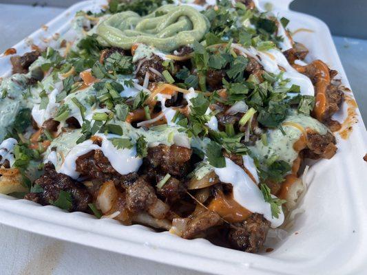 Asada fries with pastor and cilantro lime salsa