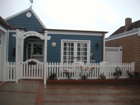 Traditional picket fence & gate w/ custom arbor