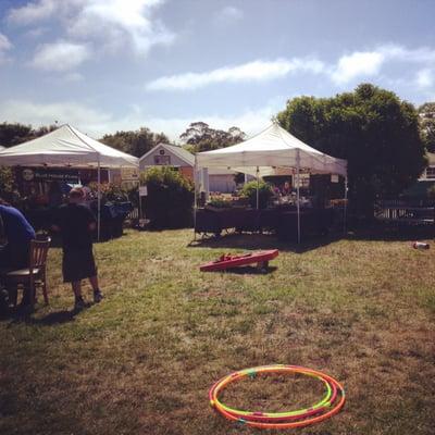 Sunny day at the Pescadero Farmers Market, complete with hula hoops and corn hole!