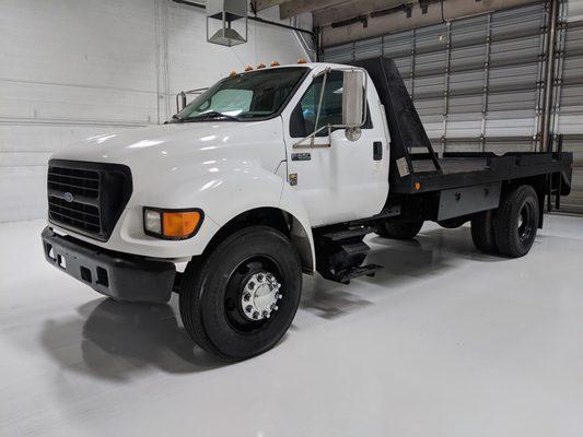 Ford F-650 16' flatbed winch truck with the legendary 7.3 liter Powerstroke. The truck only has 48,745 miles, everything works as it should.