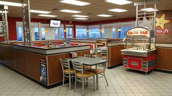 Inside Carl's Jr. looking toward the tables area with the salsa stand on the right.