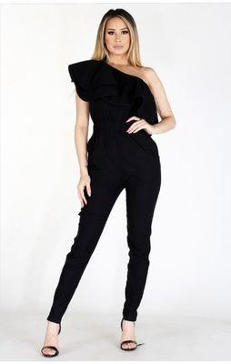 Black one-shoulder jumpsuit with ruffle detail.