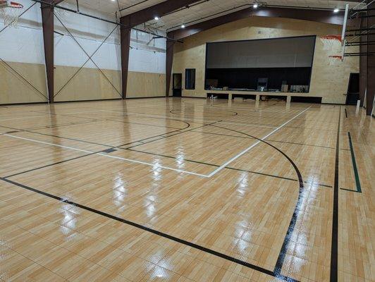 Willits Charter School's new gym. Includes a full stage, AC, projector and regulation sized court for middle school basketball.