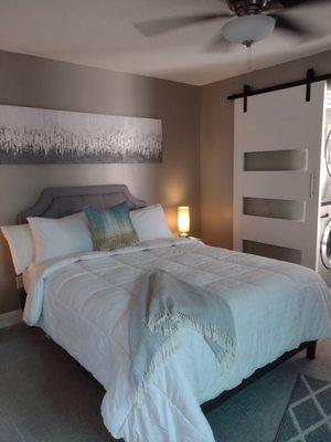 Privacy barn door separates the bath from the bedroom