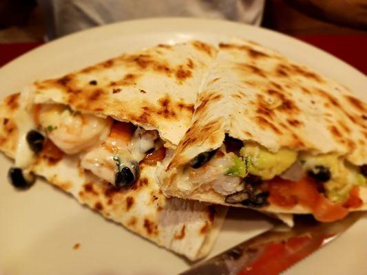 Shrimp quesadilla with beans, tomatoes,  avocados