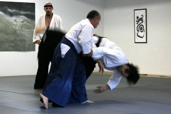 Rolling out of a body throw during multiple-style attacks.