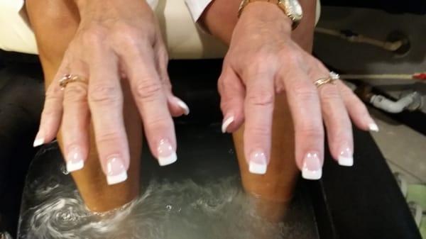 Full set of pink and white sculptured acrylic nails