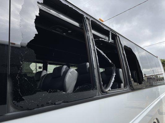 Shattered windows on a shuttle bus