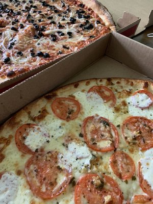 Black olive and onion pizza (left) and Marguerite pizza (right)