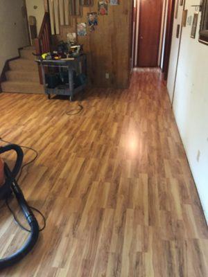 Removed carpet and installed new wood laminate floor in living room area.