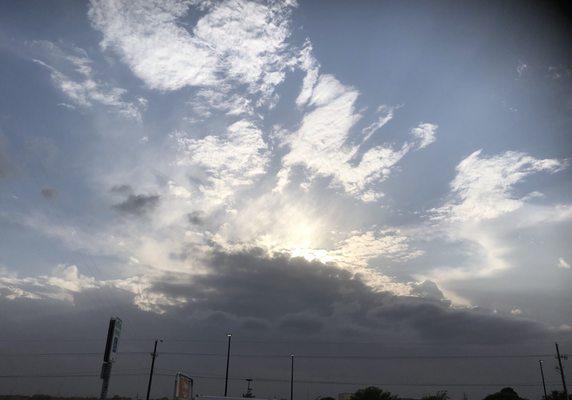 Sun behind storm clouds over Southwest Lubbock. Taken from Walmart Neighborhood Market parking lot by OGP Associate-Ray A. Perry.