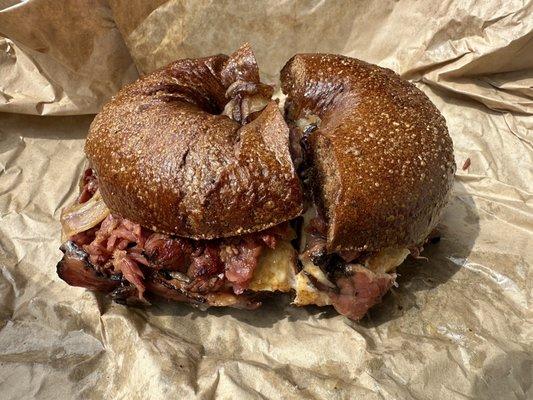 The Dadwich - hot pastrami, egg, cheese, grilled onions on pumpernickel bagel.