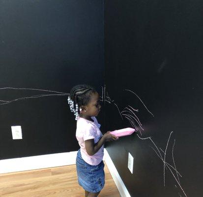 Enjoy a room where children can write and draw whatever comes to mind on our chalk wall!