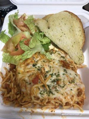 Baked spaghetti combo with side salad and homemade garlic bread